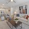 a living room with a large ceiling fan a couch