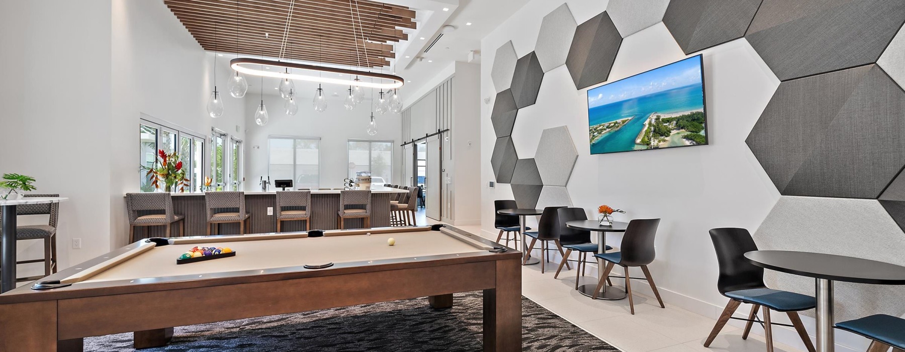 Settle into comfort at Mira at Palmer Ranch a room with a pool table and chairs