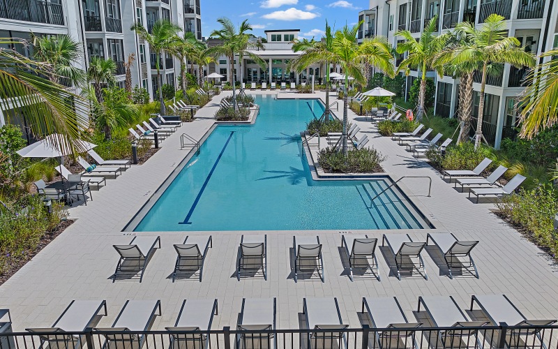 Shimmering resort-style pool a pool between buildings