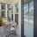 a balcony with a table and chairs