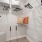 a closet with white walls and shelves