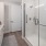 a bathroom with a shower and sink