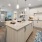 a kitchen with white cabinets and an island