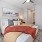 a bedroom with a bed and a fan