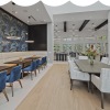 a large dining room with tables and chairs
